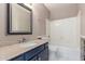 Cozy bathroom with neutral paint, granite countertops, and a shower and bathtub at 2309 W Shawnee Dr, Chandler, AZ 85224