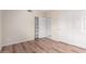 Bright bedroom with hardwood floors, white trim, and a spacious closet at 2309 W Shawnee Dr, Chandler, AZ 85224