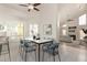 The dining area has sleek furniture next to an open-concept living space at 2309 W Shawnee Dr, Chandler, AZ 85224