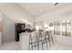 Well-lit kitchen featuring bar seating and modern appliances at 2309 W Shawnee Dr, Chandler, AZ 85224