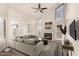 Bright living room featuring vaulted ceilings, fireplace, and modern decor at 2309 W Shawnee Dr, Chandler, AZ 85224