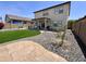Large backyard featuring artificial grass, stone patio, and low-maintenance landscaping at 2348 W Alta Vista Rd, Phoenix, AZ 85041