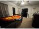 A bedroom with a ceiling fan, dresser, and a TV atop a dresser at 2348 W Alta Vista Rd, Phoenix, AZ 85041