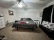 Bedroom featuring neutral carpeting, a ceiling fan, and queen-sized bed at 2348 W Alta Vista Rd, Phoenix, AZ 85041