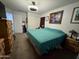 A good-sized bedroom featuring a closet and multiple dressers at 2348 W Alta Vista Rd, Phoenix, AZ 85041