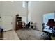 Bright living room with high ceilings and ample natural light from multiple large windows at 2348 W Alta Vista Rd, Phoenix, AZ 85041