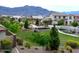 Picturesque neighborhood featuring lush landscaping, walking paths, and mountain views in the distance at 2348 W Alta Vista Rd, Phoenix, AZ 85041