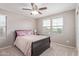 Charming bedroom featuring a ceiling fan and plush carpeting for ultimate comfort at 2425 E Flintlock Dr, Gilbert, AZ 85298
