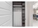 Functional closet with shelves and rod for organized storage solutions in a modern home at 2425 E Flintlock Dr, Gilbert, AZ 85298