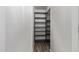 Spacious walk-in closet with custom shelving and wood-look floors provides ample storage at 2425 E Flintlock Dr, Gilbert, AZ 85298