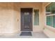 Elegant front door with decorative glass and a modern doorbell at 2425 E Flintlock Dr, Gilbert, AZ 85298