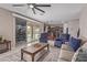 Open-concept living area connects to kitchen and features sliding glass doors for seamless indoor-outdoor living at 2425 E Flintlock Dr, Gilbert, AZ 85298