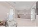 Comfortable upstairs living area with a cozy chair and a stylish chandelier hanging from the ceiling at 2425 E Flintlock Dr, Gilbert, AZ 85298