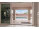 View from indoor living space to pool, yard and block fence in the background at 2425 E Flintlock Dr, Gilbert, AZ 85298