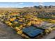 Aerial view showcasing the community park, tennis courts, and walking trails at 2425 W Bronco Butte Trl # 1056, Phoenix, AZ 85085