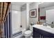 Well-lit bathroom featuring a tub, shower, modern fixtures, and decorative accents at 2425 W Bronco Butte Trl # 1056, Phoenix, AZ 85085