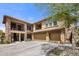 Elegant two-story home with a multi-car garage and a meticulously landscaped front yard at 2425 W Bronco Butte Trl # 1056, Phoenix, AZ 85085