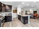 Modern kitchen features stainless steel appliances, a center island with barstool seating, and open to dining at 2425 W Bronco Butte Trl # 1056, Phoenix, AZ 85085