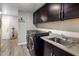 Convenient laundry room with a sink, cabinets, and modern washer and dryer units at 2425 W Bronco Butte Trl # 1056, Phoenix, AZ 85085