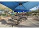 Community park with playground equipment, picnic tables, and shade structures at 2425 W Bronco Butte Trl # 1056, Phoenix, AZ 85085