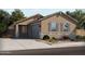 Charming single-story home boasts stone accents, gray shutters, and desert landscaping at 2674 E Santa Rosalia Dr, Casa Grande, AZ 85194