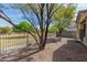 Low maintenance backyard landscaping with view of the park beyond the fence at 2701 S Southwind Dr, Gilbert, AZ 85295