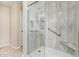 Modern bathroom with a glass door shower featuring tile walls at 2701 S Southwind Dr, Gilbert, AZ 85295