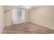 Empty bedroom featuring wood-style tile flooring, a ceiling fan and a window with curtains at 2701 S Southwind Dr, Gilbert, AZ 85295