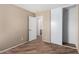 A secondary bedroom featuring tile floors and a closet with sliding doors at 2701 S Southwind Dr, Gilbert, AZ 85295