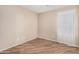A secondary bedroom featuring tile floors, neutral paint and bright natural light at 2701 S Southwind Dr, Gilbert, AZ 85295