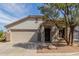 Charming single-story home with a two-car garage, a neutral color palette and a tile roof at 2701 S Southwind Dr, Gilbert, AZ 85295