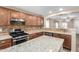 Stylish kitchen boasts granite countertops, a center island, and stainless steel appliances at 2701 S Southwind Dr, Gilbert, AZ 85295