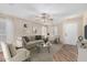 Staged living room boasts neutral tones, comfortable seating, and stylish decor at 2701 S Southwind Dr, Gilbert, AZ 85295