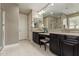 A bathroom with double sinks, vanity, soaking tub and shower at 2792 N Acacia Way, Buckeye, AZ 85396