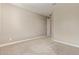 Spacious bedroom featuring neutral-colored carpet and a ceiling light at 2792 N Acacia Way, Buckeye, AZ 85396