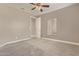 Bedroom with ceiling fan and a mirror on the right wall at 2792 N Acacia Way, Buckeye, AZ 85396