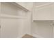 Bright closet featuring shelving and rod for hanging clothes at 2792 N Acacia Way, Buckeye, AZ 85396