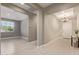 Hallway with wood-look floors, neutral-toned walls, and a glimpse into adjacent rooms at 2792 N Acacia Way, Buckeye, AZ 85396
