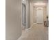 Hallway with wood-look floors and access to rooms at 2792 N Acacia Way, Buckeye, AZ 85396
