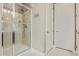 Modern shower with dual shower heads, glass doors and white tiling at 2792 N Acacia Way, Buckeye, AZ 85396