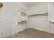 Bright walk-in closet with built-in shelving and ample hanging space at 2792 N Acacia Way, Buckeye, AZ 85396