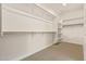 A spacious walk-in closet with shelving and rods for optimal storage at 2792 N Acacia Way, Buckeye, AZ 85396