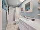 Bathroom features include tile flooring, walk-in shower, and crisp white vanity at 3108 W Butler Dr, Phoenix, AZ 85051