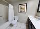 Cozy bathroom features a vanity with a dark wood cabinet and a shower-tub combo at 3108 W Butler Dr, Phoenix, AZ 85051