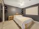 Well-lit bedroom features carpet floors, ceiling fan and a comfy bed at 3108 W Butler Dr, Phoenix, AZ 85051