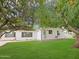 Charming single-story home with a well-maintained lawn and mature trees at 3108 W Butler Dr, Phoenix, AZ 85051