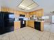 Functional kitchen with black appliances, and light wood cabinetry at 3108 W Butler Dr, Phoenix, AZ 85051