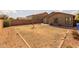 The backyard features a brick perimeter, privacy fence, and a small patio at 3122 W Dunbar Dr, Phoenix, AZ 85041