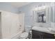 Bathroom with a vanity with dark wood storage underneath at 3122 W Dunbar Dr, Phoenix, AZ 85041