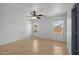 Bright bedroom with wood look floors and natural light at 3122 W Dunbar Dr, Phoenix, AZ 85041